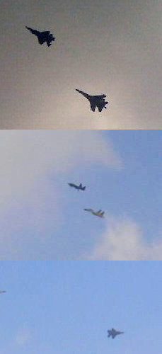 資料圖：AMF五代戰(zhàn)機(jī)在殲-11BS戰(zhàn)斗機(jī)的伴隨下進(jìn)行通場(chǎng)飛行。