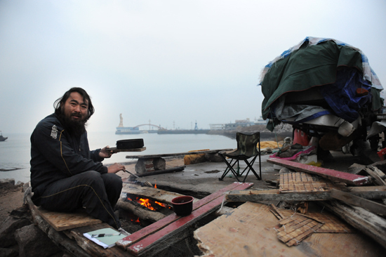 小麥島流浪王 中國(guó)阿甘騎三輪走中國(guó)